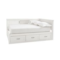 a white bed with two drawers underneath it