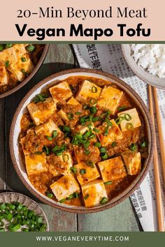 vegan tofu in a bowl with chopsticks and rice on the side