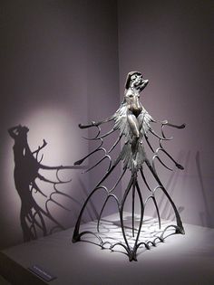 a sculpture in the shape of a woman's body and hands on top of it