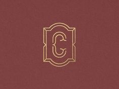 the letter c in gold on a maroon background