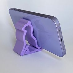 an image of a cell phone holder on the back of a tablet pc or other device