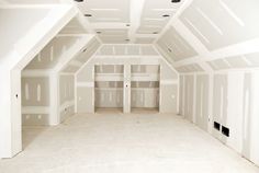 an empty room with white walls and no one in the room or there is something on the floor