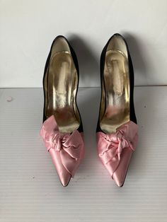 SZ  EU 38.5 or US 10 LENGTH 11 .5" WIDTH 3.25" INSOLE 10" HEEL HEIGHT 4" CHRISTIAN LACROIX black and pink satin evening pump large pink satin bow on the vamp 4" covered heel leather insole with a padded foot bed  Dress up in mega style,  IN THESE BEAUTIFUL CHRISTIAN LACROIX shoes pointed toe slip in style high fashion leather  sole leather lining  made in ITALY GOOD CONDITION Bed Dress, Women's Slip Ons, How To Dress A Bed, Satin Shoes, Pointed Toe Shoes, Christian Lacroix, Heel Pumps, Pink Satin, High Heel Pumps