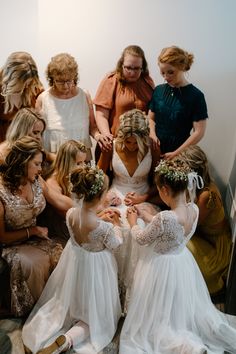 a group of women standing around each other