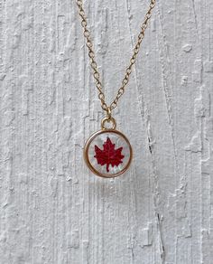 Enjoy the crisp fall leaves in any season, year round!  Beautiful dried mini punched maple leaf in resin in a small gold circular pendant on a 16" adjustable gold chain. Sure to give you those fall feelings any time you wear it! Makes wonderful bridal party, Christmas, Mother's Day, or birthday gifts for that special someone. Or buy as a treat to yourself! All jewelry is handmade by me especially for you. Each piece is unique and a one of a kind creation due to the individuality of natural flowers and resin. Flowers may not be identical and small bubbles may be present due to the resin. Please let me know if you have any questions. Enjoy! To preserve the life of your resin jewelry and keep it from tarnishing and discoloring, please remove before showering, swimming, or heavy exercise. Take Fall Leaves Resin, Resin Leaves, Fall Necklaces, Thanksgiving Jewelry, Fall Necklace, Easy Crafts To Sell, Leaves Necklace, Glitter Leaves, Autumn Necklace