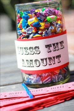 a jar filled with candy sitting on top of a wooden table