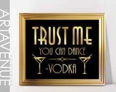 a black and gold framed sign that says trust me you can dance vodka