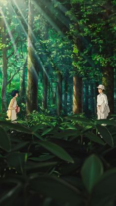 two people standing in the middle of a forest with sunlight shining through trees and leaves