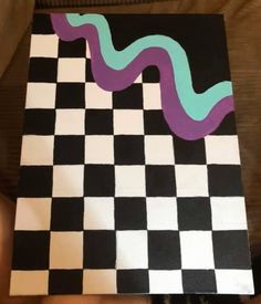 a piece of art that looks like a checkerboard board with a snake painted on it