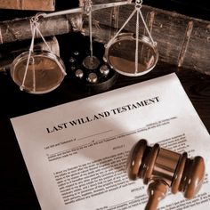 the last will and testament is next to a judge's gavel on a desk