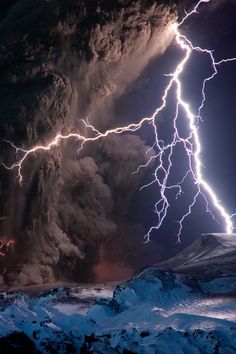 lightning strikes through the sky above a mountain