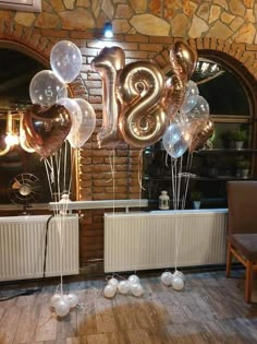 some balloons that are in the shape of numbers