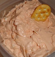 a bowl filled with food and a cracker in it