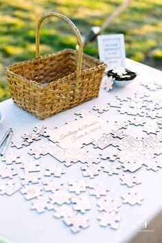 a picnic table with a basket and place cards