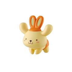 an orange and white rabbit toy is flying through the air with it's ears up