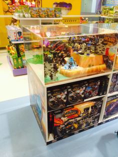 a toy store display case filled with toys