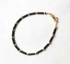 We couldn't love this more! Raven is gorgeous! Made with black bugle beads and 3mm metal beads of your choice! We offer sterling silver, gold plated or gold filled.  We suggest measuring your wrist with a soft measuring tape before ordering.  *Note gold plated will tarnish if exposed to water and/or chemicals. Black Beads Designs, Raven Bracelet, Black And Gold Jewelry, Gold Bracelet Design, Kids Gold Jewelry, Mom Bracelet, Gold Jewelry Outfits, Black Beads Mangalsutra Design, Mangalsutra Design