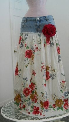 a woman's skirt with flowers on it is displayed in front of a door