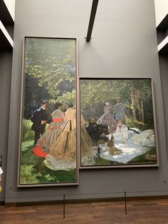 two paintings hanging on the wall next to each other