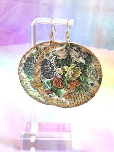 These stained wooden earrings feature a decoupaged beetle and floral collage. All sealed with with a brushed on shiny top-coat. Collage Decoupage, Floral Collage, Decoupage Ideas, Wooden Earrings, Top Coat, Decoupage, Jewelry Earrings Dangle, Etsy Earrings, Dangle Drop Earrings