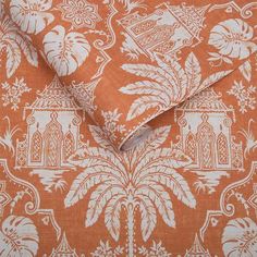 an orange and white wallpaper with different designs on the fabric, including palm trees