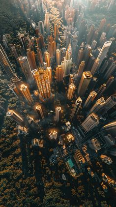 an aerial view of a city with tall buildings and lots of trees in the foreground