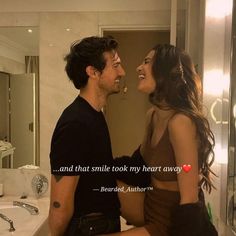 a man sitting next to a woman in front of a bathroom mirror with the caption when you are in love, the way you smile tells everything