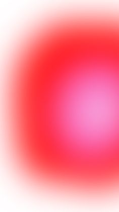 a blurry red and white background with an orange center