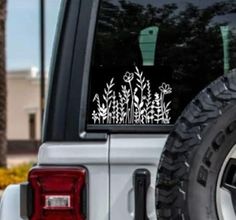 a white truck parked in front of a palm tree