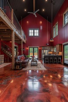 a large open living room with red walls