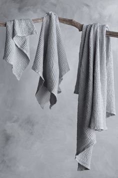 three towels hanging from a clothes line