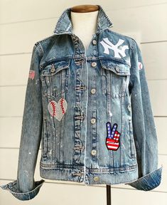 Custom Jean Jacket | Denim Jacket | Personalized | Baseball | New York Yankees Add YANKEES, the last name of your favorite player, or YOUR name to the back of your custom jacket! No two are exactly alike, as it is truly made to order just for YOU Astros patches and their placement will be decided by seller. Please PM if you have any questions! A MAXIMUM of 10 letters across. Color variation may occur due to distressing. Jackets may vary slightly in style depending on availability. INFORMATION TO Sports Jean Jacket Diy, Baseball Jean Jacket Diy, Baseball Mom Jean Jacket, Baseball Jean Jacket, Diy Denim Jacket Ideas, Baseball Attire, Jean Patches, Baseball Mom Outfits