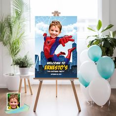 a spiderman birthday party sign with balloons in the foreground and an image of a child's face on it