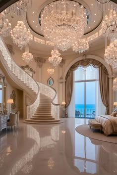 an elegant bedroom with chandelier and large windows overlooking the ocean is pictured in this image