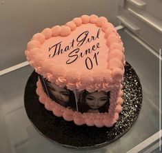 there is a cake with two faces on it and the words that girl since 01