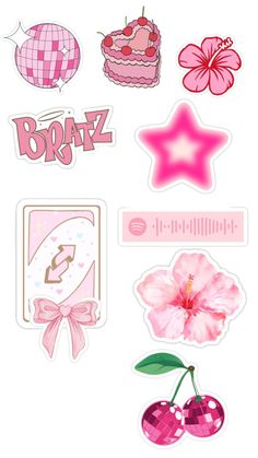 some stickers that are on the side of a white wall with pink and red decorations