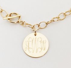 "This gold filled bracelet makes a beautiful present for your wife, mother or friend (or for yourself!). They are also perfect for for bridesmaids presents. I will engrave a monogram or name onto the round pendant. Toggle closure. Comes in gift box. Pendant - Golf Filled, 5/8\" diameter Bracelet- Gold Filled, 7\" long How to Order: 1. Place item or items in cart. (If purchasing more than one item the shipping will automatically be combined. For 5 or more items, contact me for a discounted quote. Bridesmaid Presents, Monogram Bracelet, Silver Monogram, Athens Ga, Monogram Jewelry, Gold Monogram, Monogram Necklace, Bridesmaid Bracelet, Toggle Bracelet