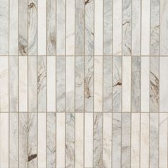 a white marble tile wall with vertical stripes