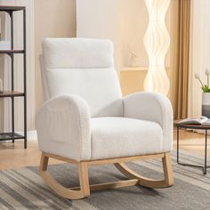 a white rocking chair in a living room