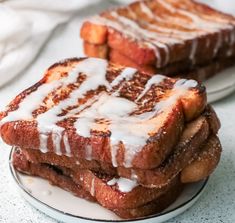 three pieces of french toast with icing on a plate