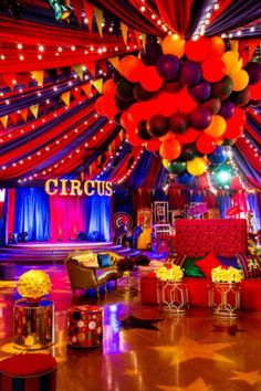 a room filled with lots of red and yellow balloons