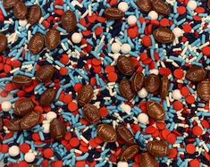 red, white and blue sprinkles with chocolate hearts on them are all over the place