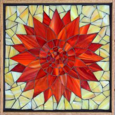 a red and yellow sunflower stained glass panel