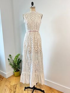 insanely beautiful antique Edwardian geometric heart shaped embroidered & eyelet lace dress. This dress has a stunning floral embroidered and eyelet skirt with high quality cotto. Hook & eye closure are present at the back middle & the top closure has been fixed since photographed!  In excellent vintage condition some very minor discolorations at hem of skirt, but in really good condition considering its age  B: 36" W: 28" L: 58 Bohemian Lace Dress With Broderie Anglaise, Lace Dress With Broderie Anglaise For Garden Party, Fitted Bohemian Lace Dress With Scalloped Lace, Sleeveless Lace Dress With Scalloped Lace For Daywear, Sleeveless Scalloped Lace Dress For Daywear, Elegant Broderie Anglaise Cotton Lace Dress, Fitted Feminine Lace Dress With Broderie Anglaise, Fitted Cotton Lace Dress With Broderie Anglaise, Fitted Cotton Lace Broderie Anglaise Dress