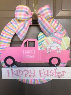 a door hanger with a pink truck painted on it and a happy easter sign