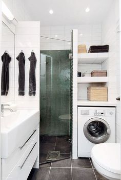 a washer and dryer in a small bathroom