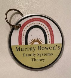 a keychain with the words murray bowen's family systems theory on it