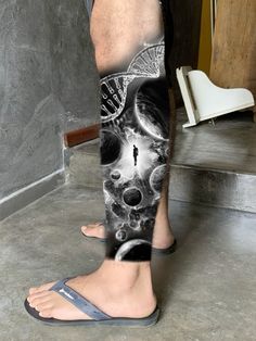 a man's leg with an artistic design on it