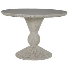 a white table with an oval top and fringed edges on the base, against a white background