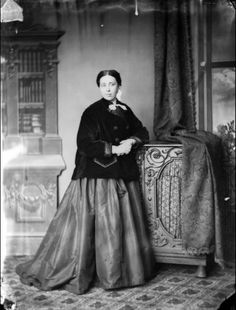 an old black and white photo of a woman